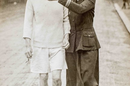 Photo of blind veteran, James Ingram, racewalking with guide