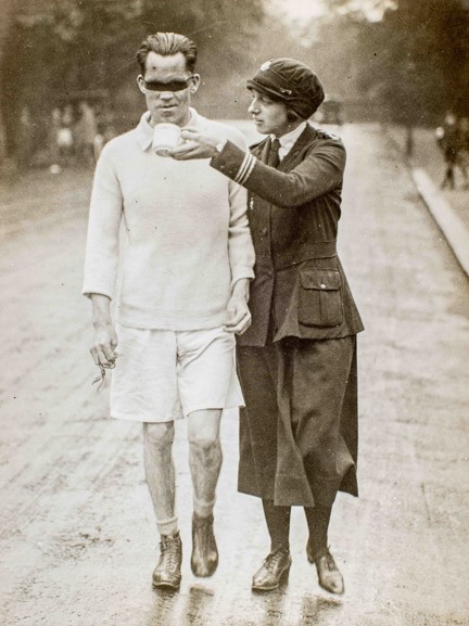 Photo of blind veteran, James Ingram, racewalking with guide