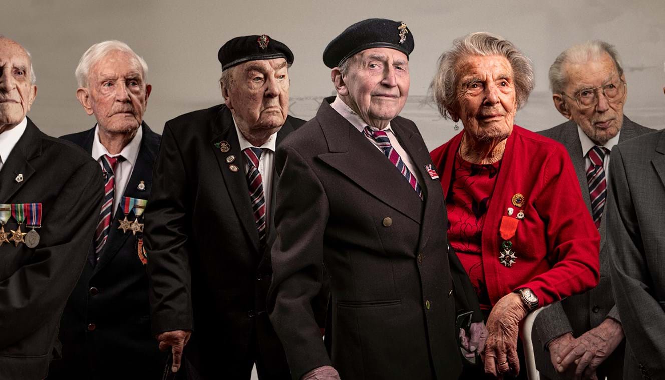 A photo of nine blind veterans edited onto a background of D-Day