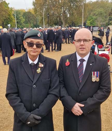 Blind veteran Mark and son Ben on Remembrance Sunday just before the march