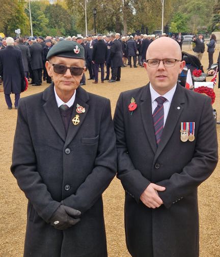 Blind veteran Mark and son Ben on Remembrance Sunday just before the march