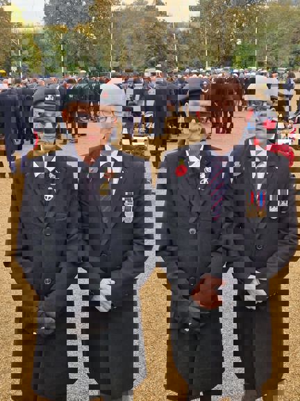 Blind veteran Mark and son Ben on Remembrance Sunday just before the march