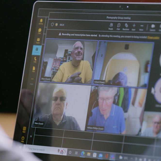 A virtual meeting of veterans on a Microsoft Teams call on a Laptop