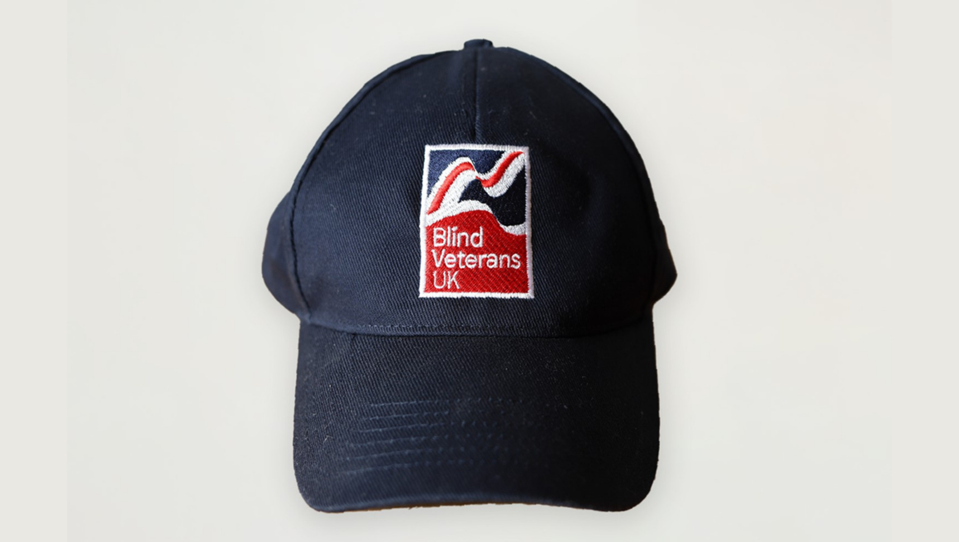 Navy blue baseball cap with Blind Veterans UK logo