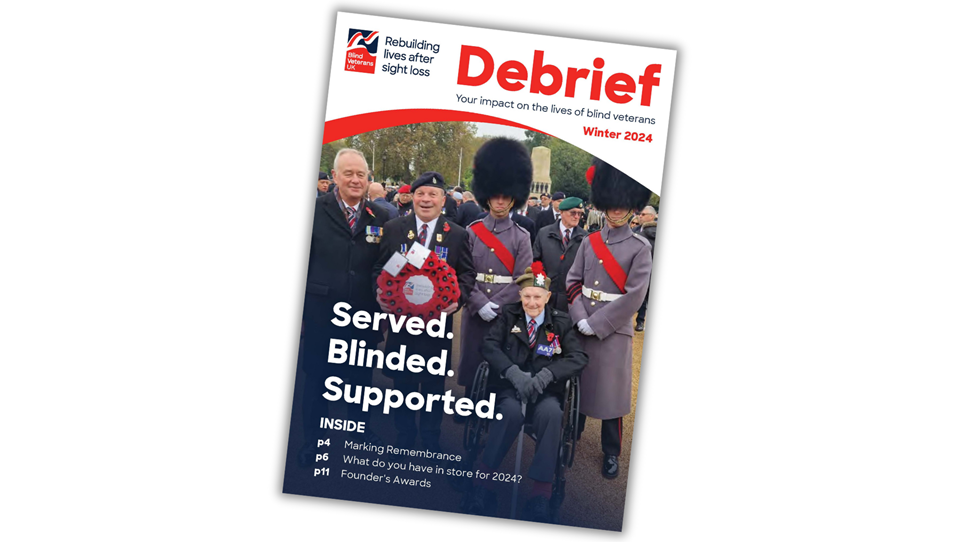 Supporter magazine front cover, with title Served. Blinded. Supported. and photograph of blind veterans with our CEO, Adrian Bell, at the London Cenotaph for Remembrance