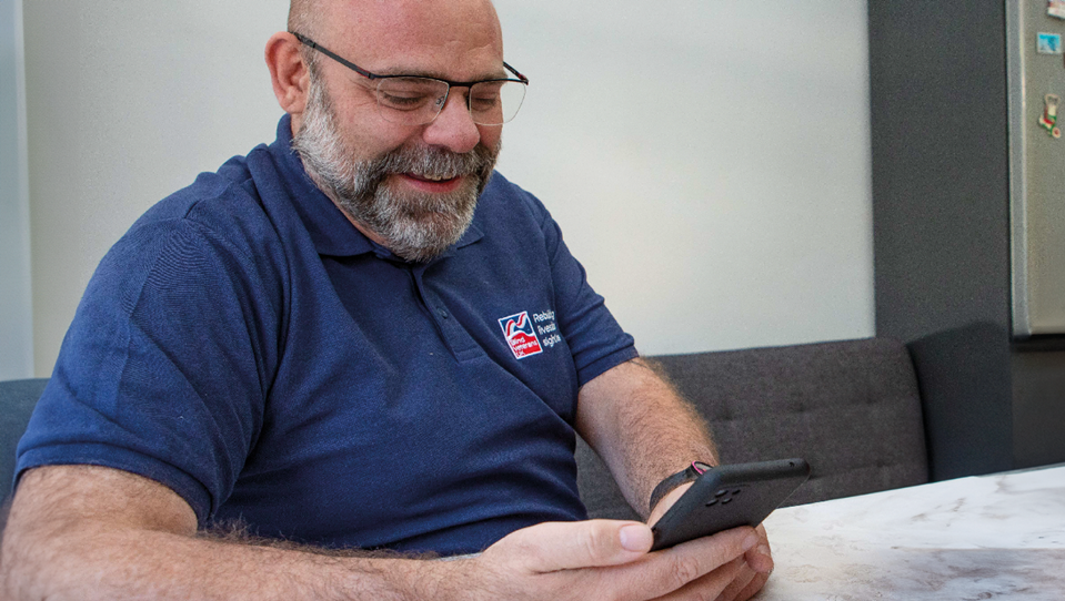 Matthew, Blind Veterans UK staff member calling on a phone