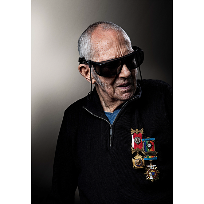 Blind veteran Woody wearing his dark glasses and medals