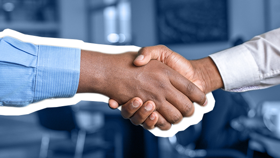 A photo of two people shaking hands