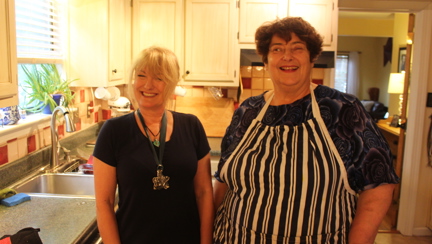 Photo of Kate, left, teaching Penny, right, her fish pie in Virginia Beach