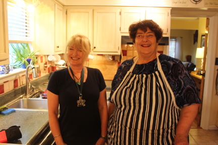 Photo of Kate, left, teaching Penny, right, her fish pie in Virginia Beach