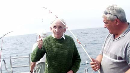 A photo of blind veteran Fred on a fishing boat