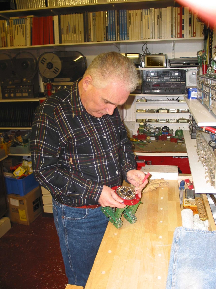 Blind veteran, Terry, pictured in his workshop, building using Meccano.