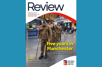 A magazine front cover with title "Five years in Manchester" and an image of our "living statue" made of blind veterans and volunteers in Piccadilly Station