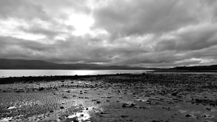 Black and white image of beach landscape