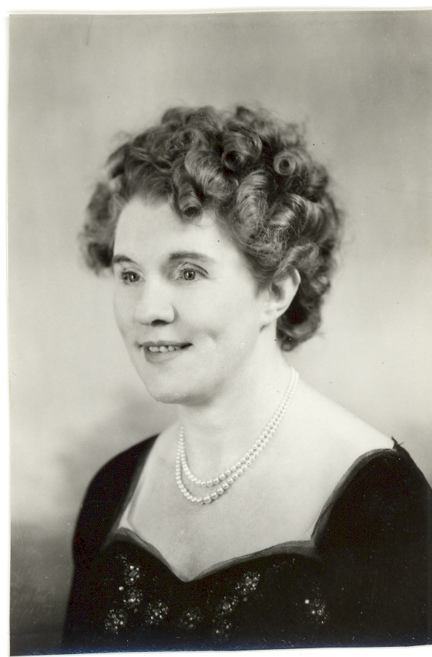 Black and white portrait photograph of Gwen Obern smiling