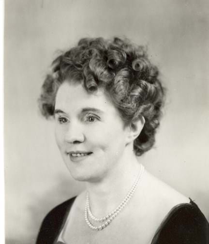 Black and white portrait photograph of Gwen Obern smiling