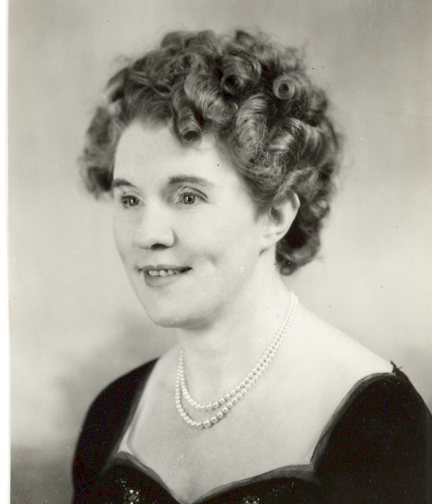 Black and white portrait photograph of Gwen Obern smiling