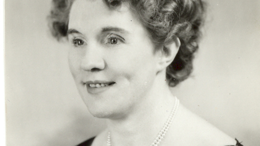 Black and white portrait photograph of Gwen Obern smiling