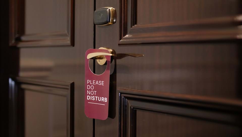Do Not Disturb sign on door handle