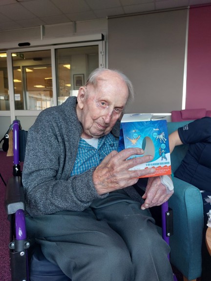 Blind veteran Ken holding a Kinder Surprise Maxi Easter Egg