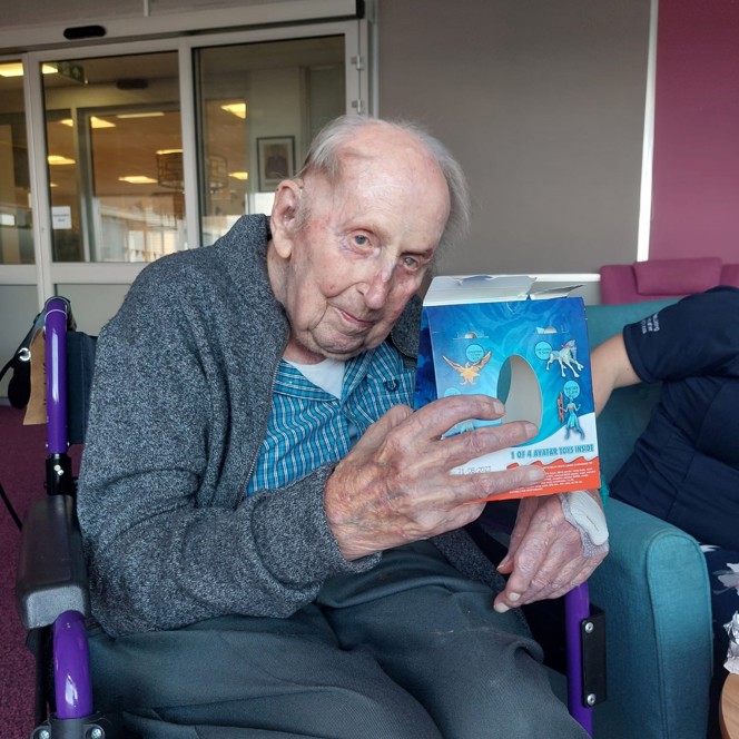 Blind veteran Ken holding a Kinder Surprise Maxi Easter Egg