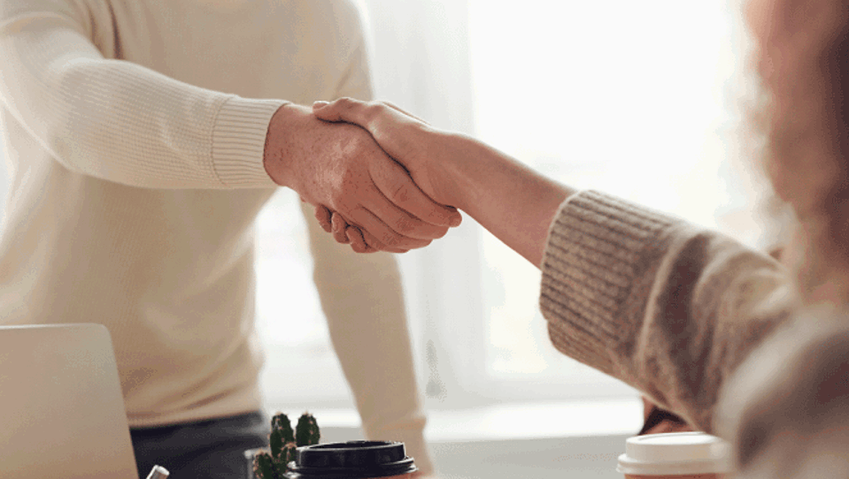 Two people shaking hands