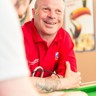 Portrait of blind veteran Billy, resting arms against a table