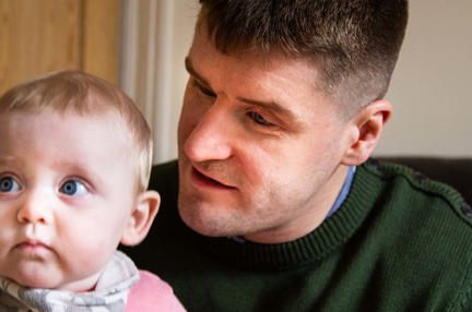 Photo of blind veteran Rob with his daughter