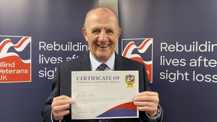 Jules Lee holding his certificate at Founder's Awards 2023