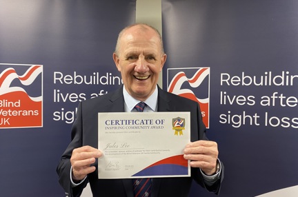 Jules Lee holding his certificate at Founder's Awards 2023