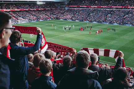 A photo of a group watching a football game