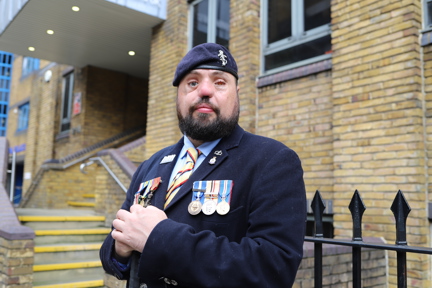 Blind veteran Simon with medals