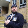 Blind veteran Simon with medals