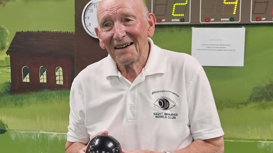 Blind veteran Les holding one of his bowls