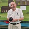 Blind veteran Les holding one of his bowls