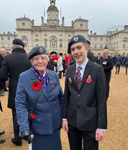Photo of blind veteran Janet with her Great Grandson at Cenotaph 2023