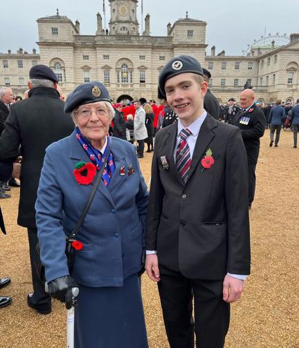 Photo of blind veteran Janet with her Great Grandson at Cenotaph 2023