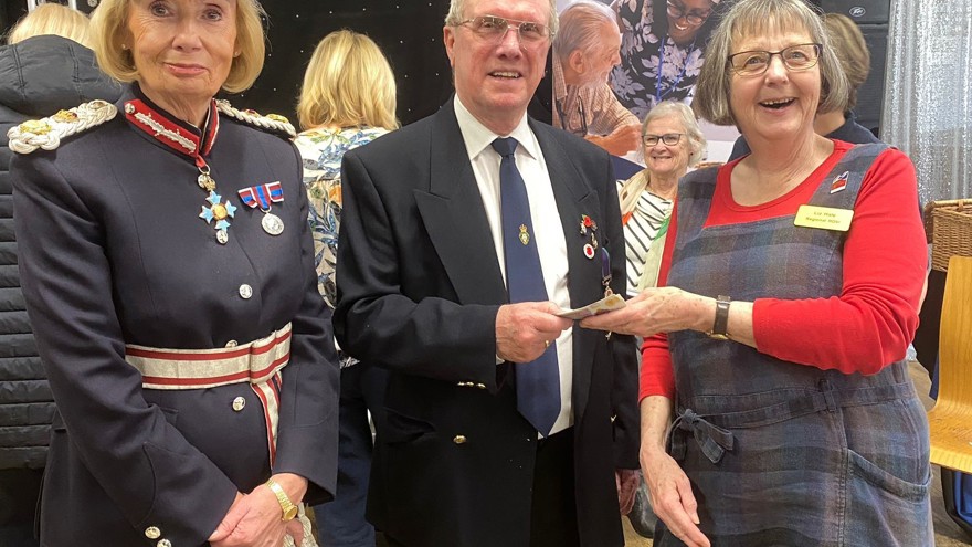 Our Rehab Officer Liz smiles as she accepts the money. The Chairman of Shirebrook Royal British Legion hands over the money. He is standing next to the Lord Lieutenant of Derbyshire.