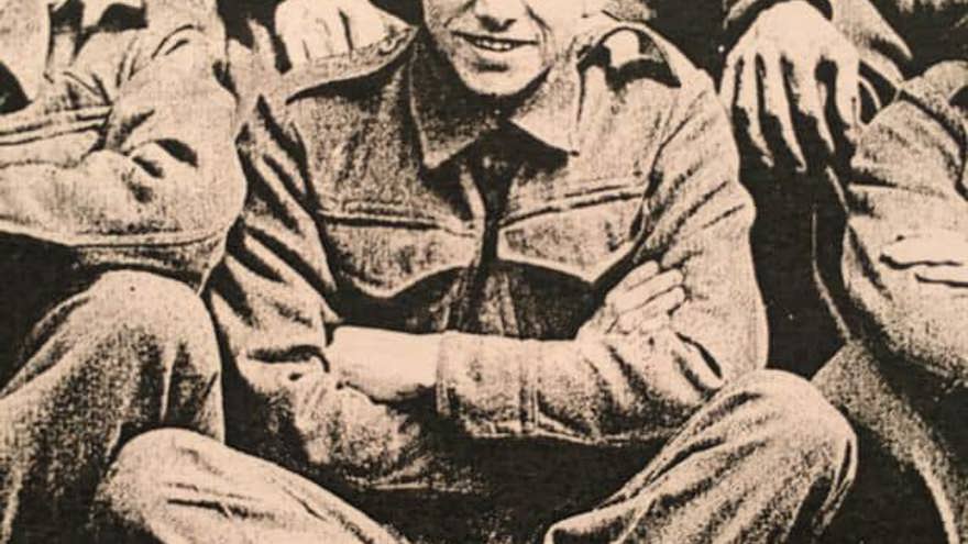 A black and white photo of blind veteran George in his military uniform