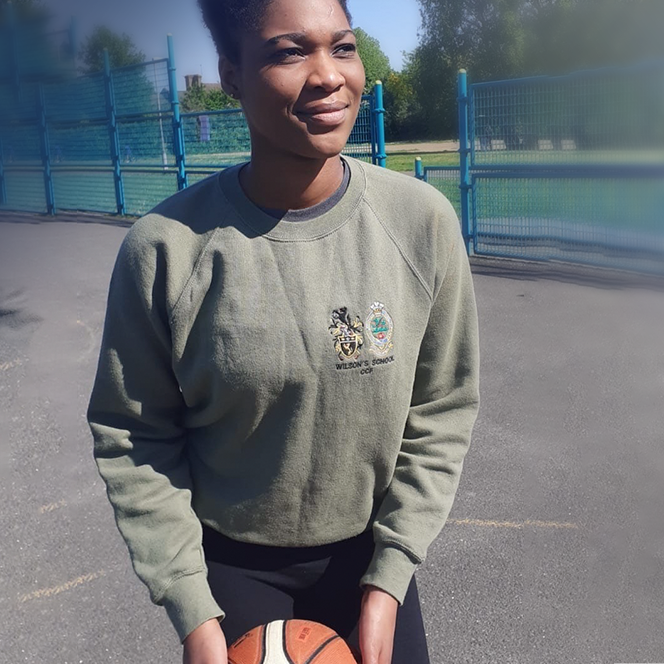 A photo of a young cadet playing basketball to help fundraise