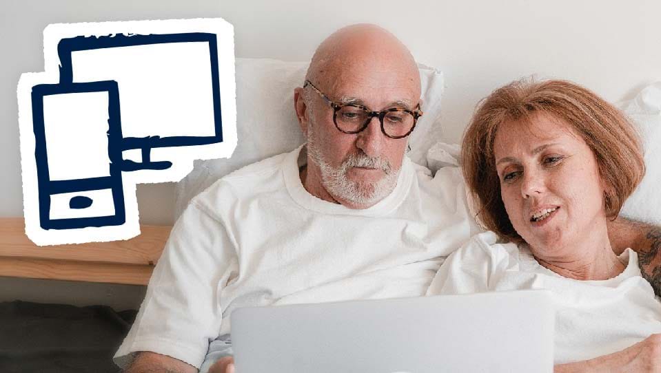 A photo of a man and woman using a laptop