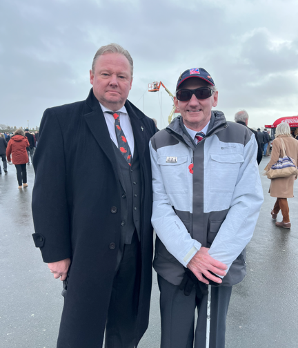 Blind veteran Ted and Blind Veterans UK supporter Fitz at Plymouth Hoe