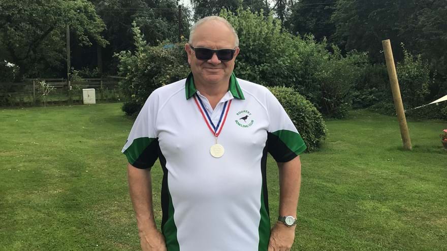 Photo of Steve, blind veteran, wearing national bowls medal