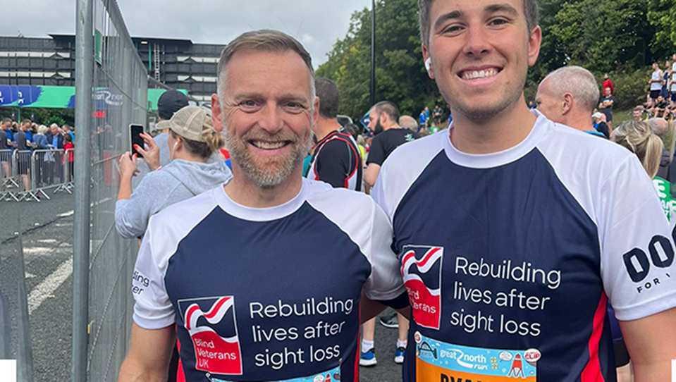 Two supporters wearing branded t-shirts after a marathon
