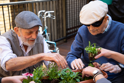 Photo of blind veterans Ken, left, and Richard, right, gardening