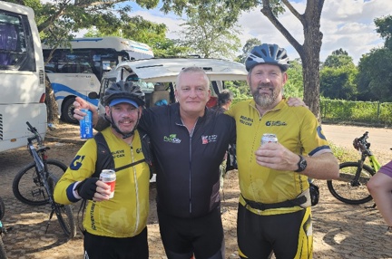 Colin stood between two of the guides that led the challenge.  All in cycling shorts and cycling tops 