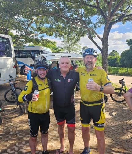 Colin stood between two of the guides that led the challenge.  All in cycling shorts and cycling tops 