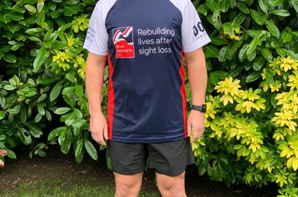 Veteran Justin, in running gear and a Blind Veterans UK top