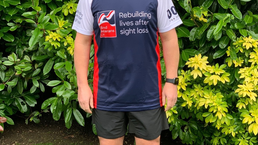 Veteran Justin, in running gear and a Blind Veterans UK top