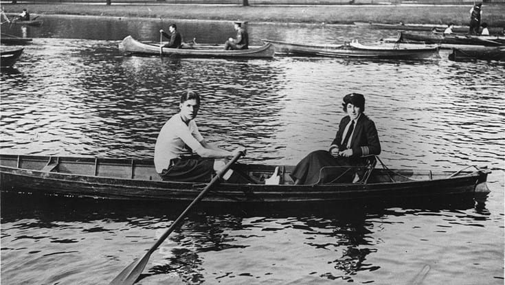 An archive photograph of a blind veteran rowing with an instructor in a boating lake at Regent Park